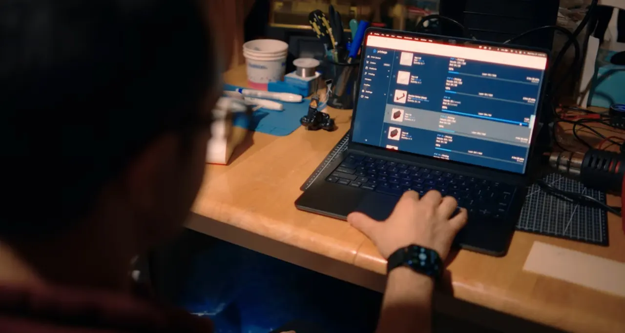 Voxolite operator at a laptop reviewing the Printago order queue.