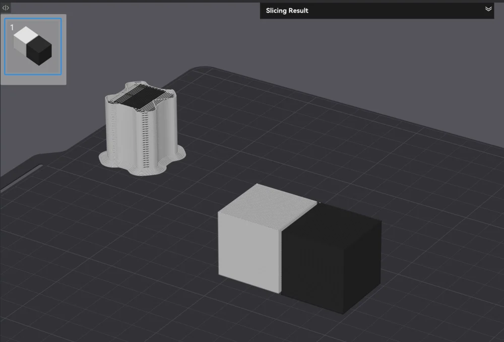 A sliced two-color print in Bambu Studio showing the prime tower beside the parts